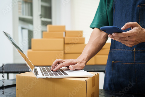 A man is working at his desk, preparing parcel boxes for shipment. He checks and packs items carefully, using shockproof materials, and attaches labels before sending them to customers via EMS.