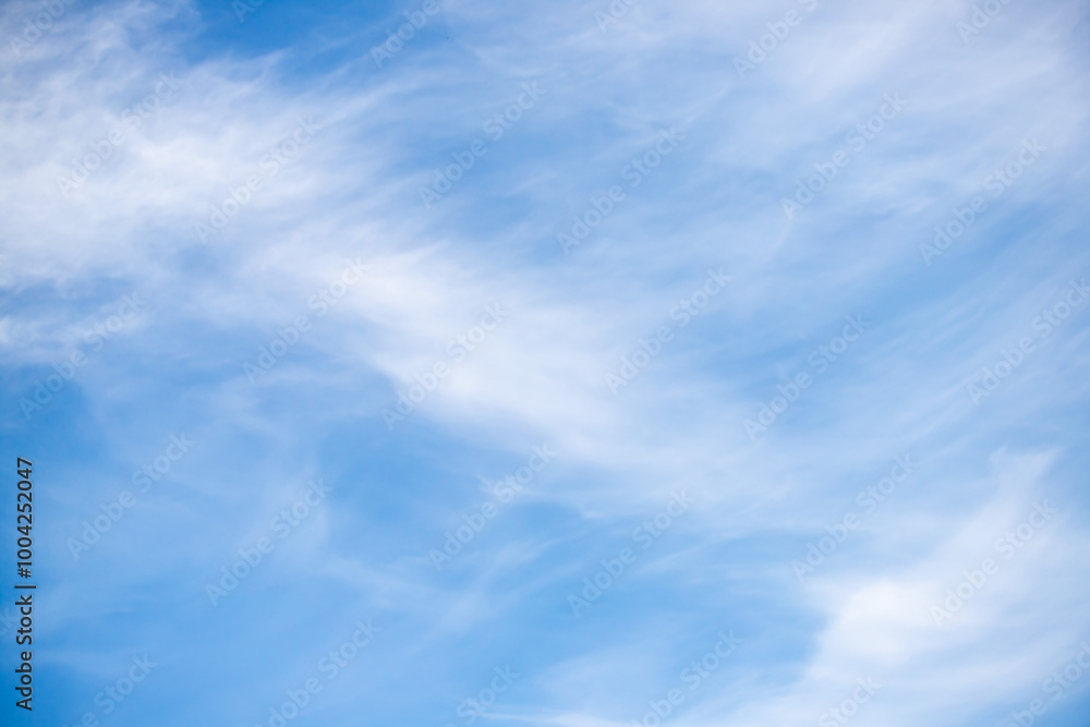 The sky is blue and clear with a few clouds scattered throughout The sky is blue and clear with a few clouds scattered throughout