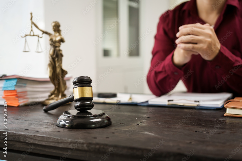A male lawyer is working at his desk on an online judicial review, focusing on justice, fairness, and legal compliance.He reviews cases, contracts, and legal matters based on general law principles A male lawyer is working at his desk on an online judicial review, focusing on justice, fairness, and legal compliance.He reviews cases, contracts, and legal matters based on general law principles