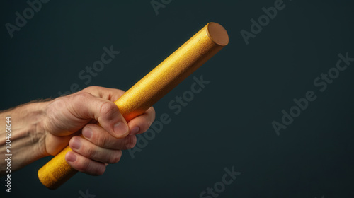 Baton Exchange in Relay Race, close-up of baton firmly held in receiver's hand, dynamic motion, teamwork and precision in athletic competition, capturing the excitement of the moment photo