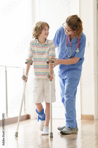 Injured child on crutches. Boy in cast on foot