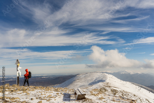Fototapeta Naklejka Na Ścianę i Meble -  Lone Hiker on the Winter Peak of Połonina Caryńska
