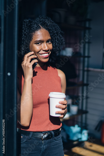 Fotografía Half length portrait of cheerful millennial hipster girl with hot drink in hand