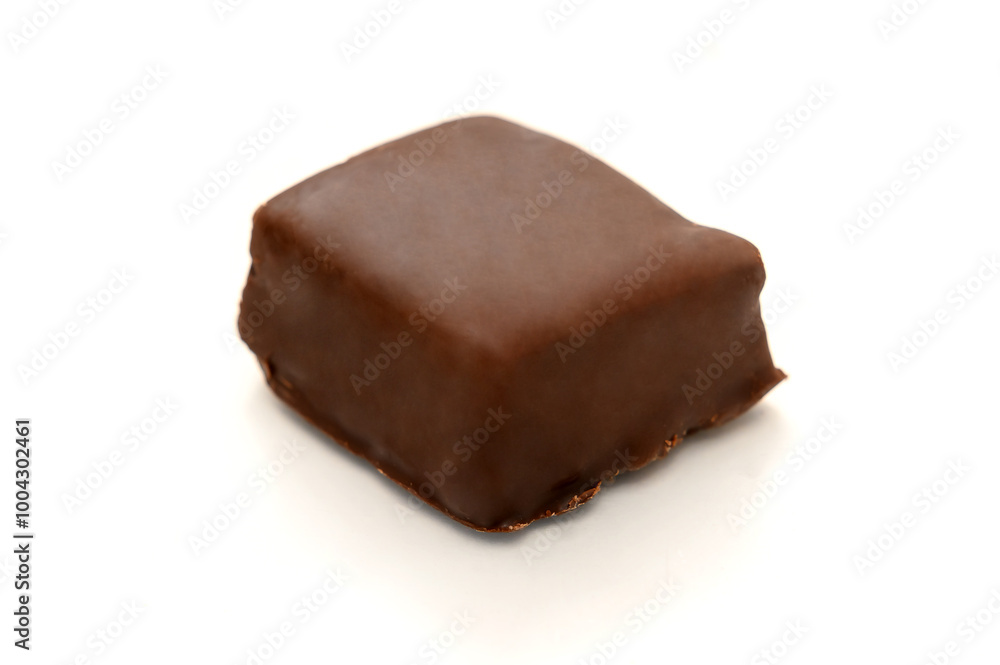 Halva in chocolate on a white background. Sweet oriental dessert. Halva in chocolate on a white background. Sweet oriental dessert.