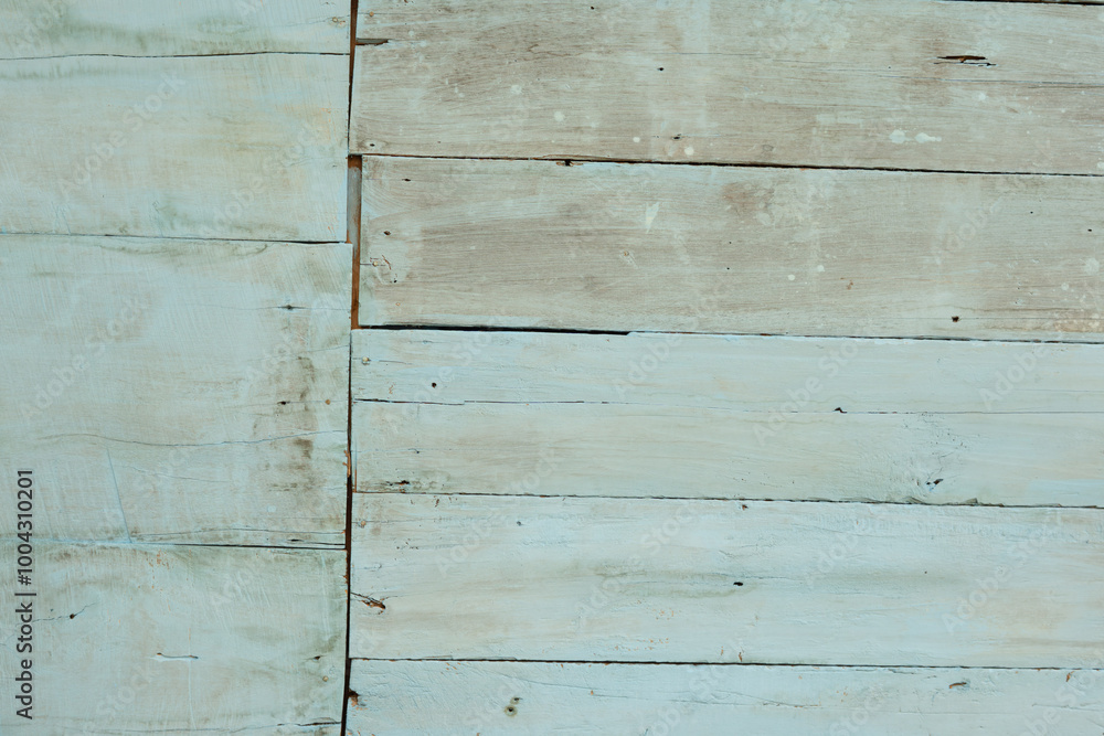 Naklejka premium The worn out plank walls painted blue look fragile