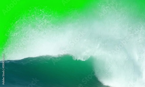 The effect of large, tall waves heading towards the camera on a green background