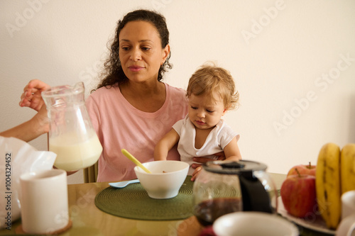 Mother and child enjoying breakfast at the kitchen table