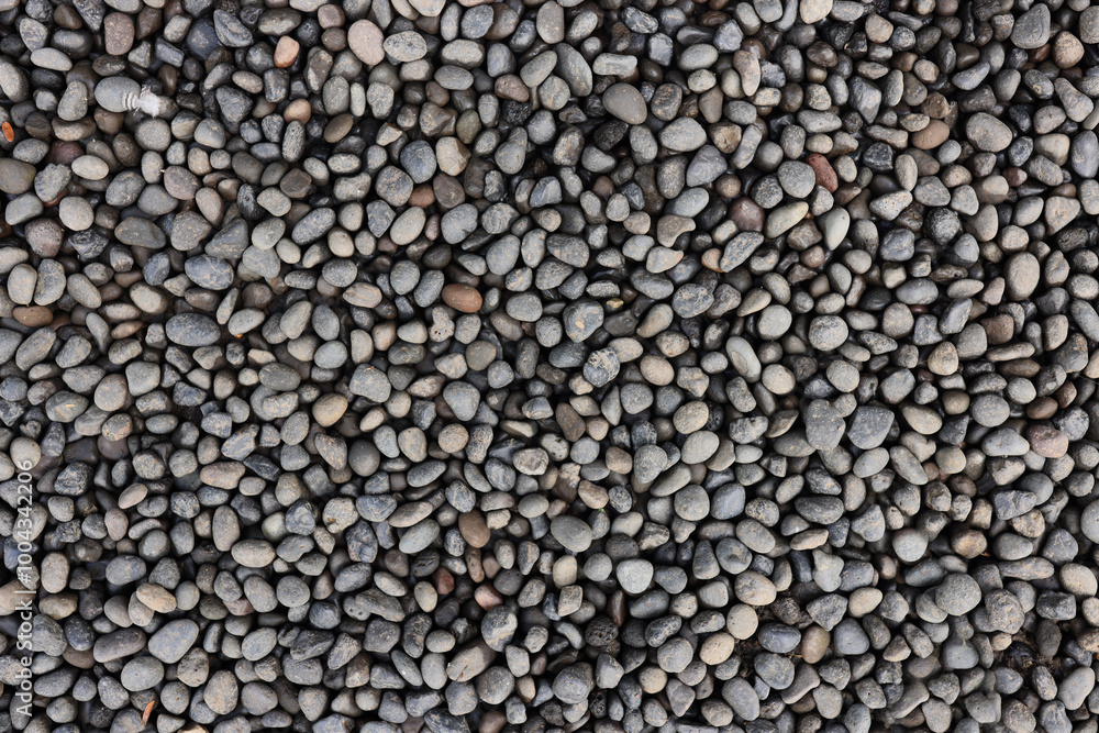 Structure of small rounded stones with carefully polished surfaces arranged in an abstract pattern Structure of small rounded stones with carefully polished surfaces arranged in an abstract pattern