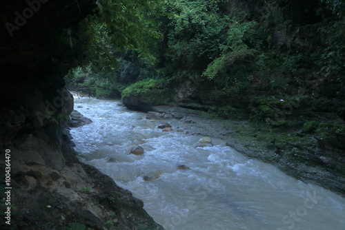 Beautiful views of the flowing river at Tapkeshwar Temple in Dehradun from different angles. photo