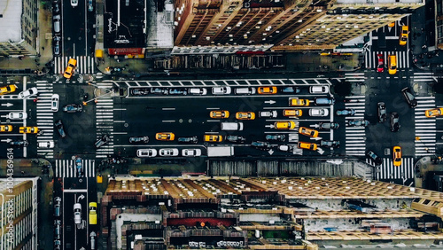 Aerial view of New York downtown building roofs. Bird's eye view from helicopter of cityscape metropolis infrastructure, traffic cars, yellow cabs moving on city streets and crossing district avenues