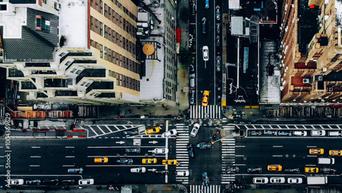 Aerial view of New York downtown building roofs. Bird's eye view from helicopter of cityscape metropolis infrastructure, traffic cars, yellow cabs moving on city streets and crossing district avenues