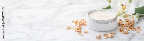 A tin of solid perfume on a marble slab, surrounded by sandalwood shavings and orchid flowers, in a minimalist style with a clean background