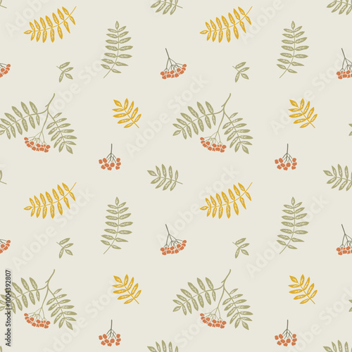 Rowan berries and leaves seamless pattern. Graphic background with autumn branch. Hand drawn fall illustration and wallpaper art.