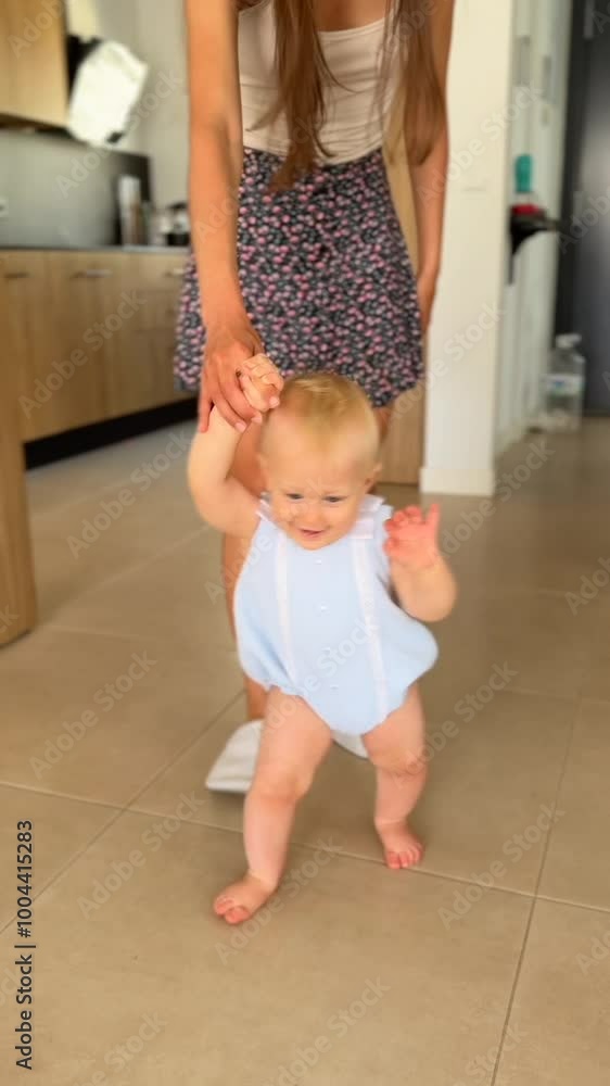 A Joyful Baby Taking Their Very First Steps with Support from a Loving Caregiver A Joyful Baby Taking Their Very First Steps with Support from a Loving Caregiver
