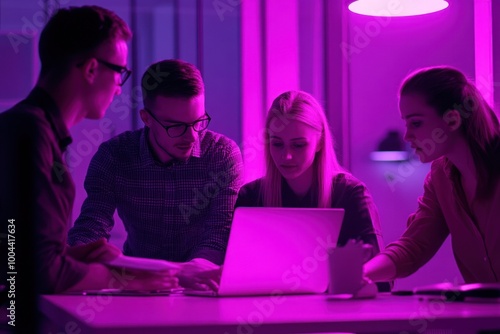 Obraz na płótnie Focused team analyzing project data under purple glow w salonie