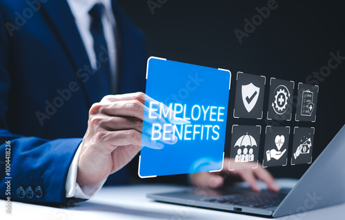 Employee Benefits and Compensation Strategy Concept. Businessman presents employee benefits options on a digital interface. Icons various benefits such as healthcare, insurance, and financial perks. photo