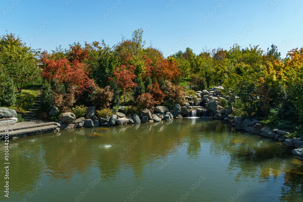 Beautiful view of large lake Oike in Japanese garden. Public landscape park of Krasnodar or Galitsky Park, Russia. Beautiful view of large lake Oike in Japanese garden. Public landscape park of Krasnodar or Galitsky Park, Russia.