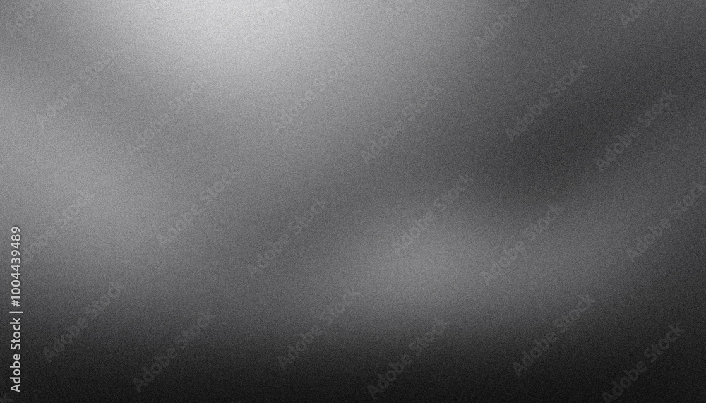 Brushed metal texture background with a grainy surface, showing a gradient from light to dark Brushed metal texture background with a grainy surface, showing a gradient from light to dark