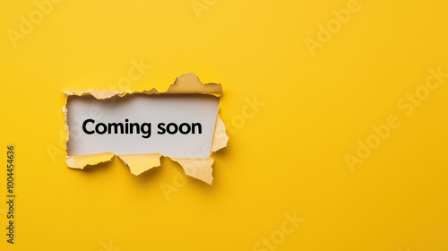 Coming soon is prominently displayed on torn piece of paper against bright yellow background, creating engaging and anticipatory visual