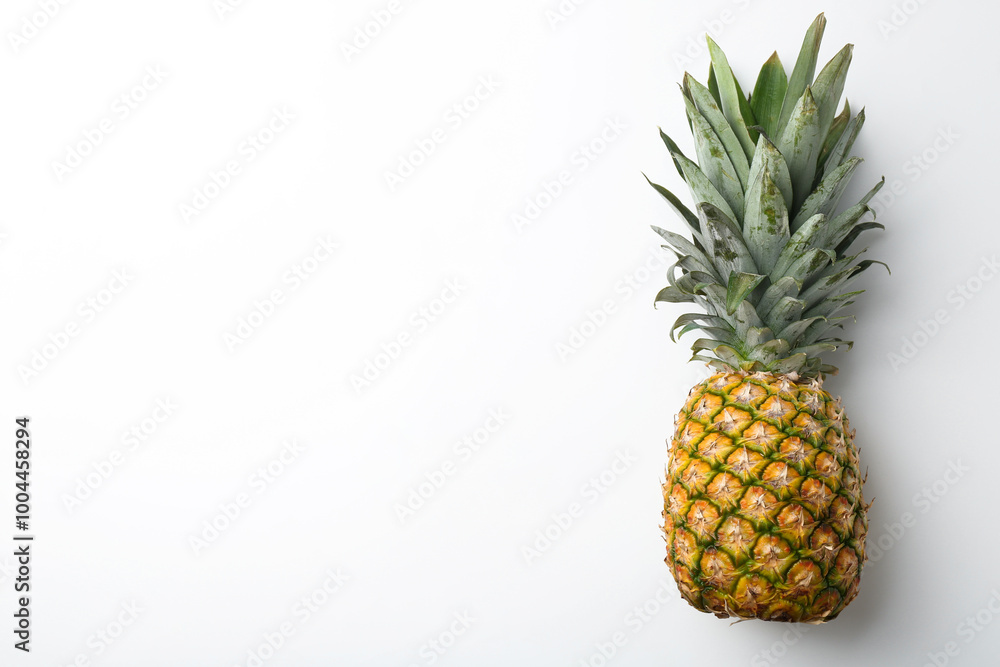 One fresh ripe pineapple on white background, top view. Space for text One fresh ripe pineapple on white background, top view. Space for text