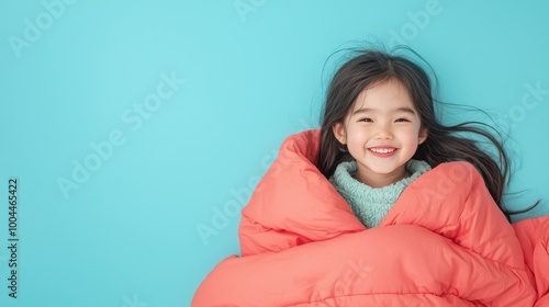 Happy child wrapped in blanket, cheerful moment photo