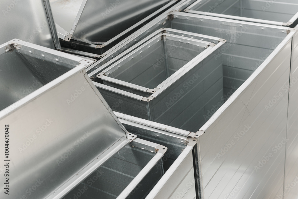 Ventilation rectangular ducts and pipeline parts on store outdoors.