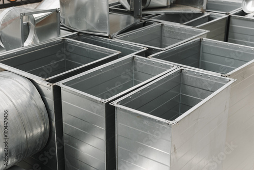 Ventilation rectangular ducts and pipeline parts on store outdoors.