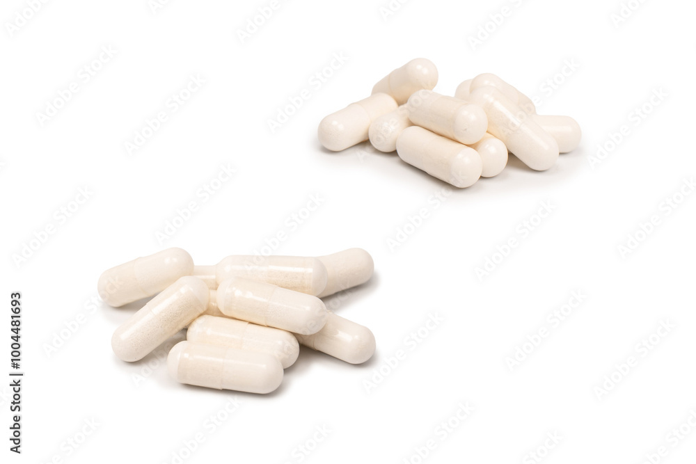 White pill capsule isolated on a white background. White pill capsule isolated on a white background.