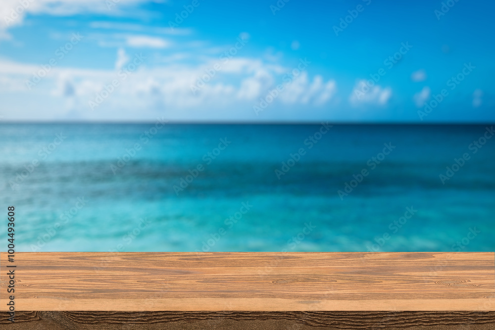 Wood table top on blur summer blue sea and sky background - can be used for display or montage your products Wood table top on blur summer blue sea and sky background - can be used for display or montage your products