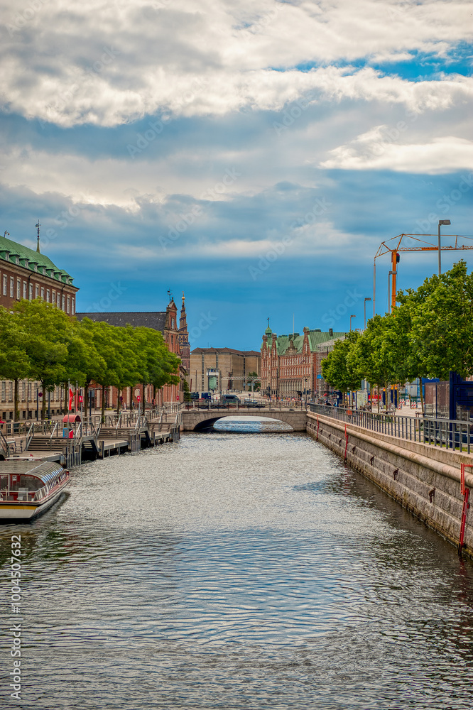 Obraz premium Copenhagen, the capital of Denmark, is located on the offshore islands of Zealand and Amager. It is connected to Malmo in southern Sweden via the Öresund Bridge.