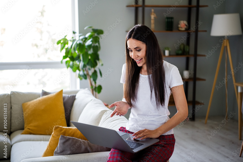 Photo of lovely young girl video call talking netbook dressed sleepwear good morning wake up spacious house indoors room Photo of lovely young girl video call talking netbook dressed sleepwear good morning wake up spacious house indoors room