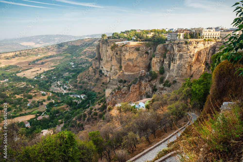 Obraz premium Houses built on the edge of the cliff in the ancient city of Ronda, andalucia, Spain