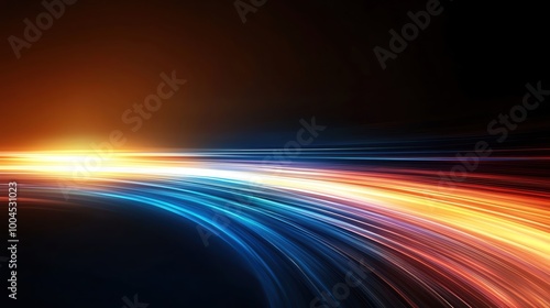Vibrant light trails in dynamic motion against a dark background  creating a sense of energy and movement.