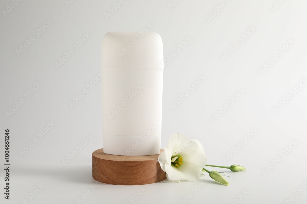 Solid deodorant and beautiful eustoma flower on white background Solid deodorant and beautiful eustoma flower on white background