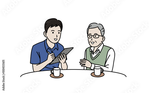 高齢者と相談をする介護士の男性
