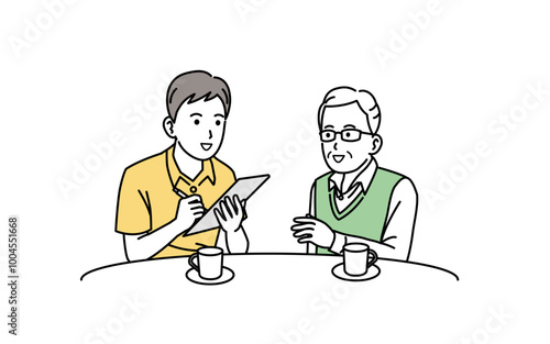 高齢者と相談をする介護士の男性