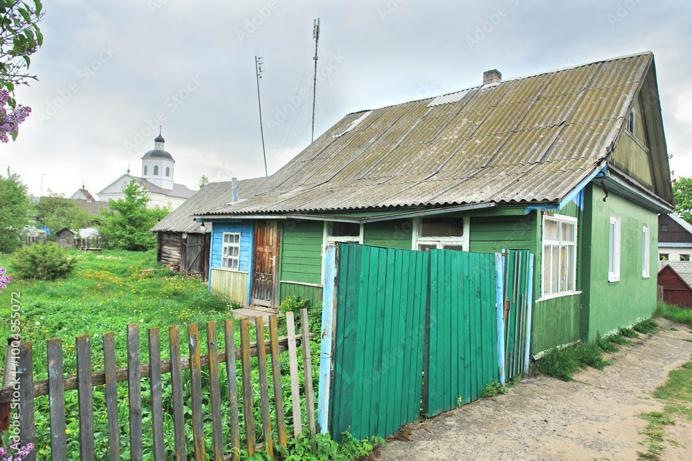 View of wooden houses in the town of Raków in Belarus, formerly Polish territory View of wooden houses in the town of Raków in Belarus, formerly Polish territory