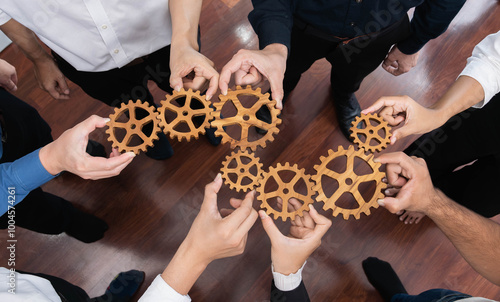 Business team joining cogwheel in circular together symbolize successful group of business partnership and strong collective unity teamwork in community workplace with productive efficiency. Prudent