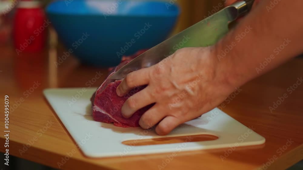 meticulous cut of fresh beef is being prepared in a cozy home kitchen, showcasing the art of butchery. The scene emphasizes the textures and colors of the meat