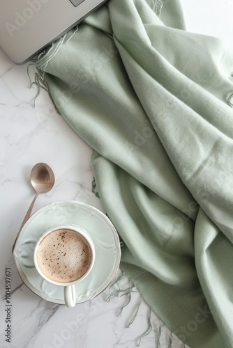 soft green sage beige feminine scarf with laptop and coffee photo