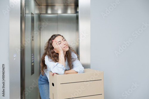 Very happy young woman arriving at her new house with cardboard moving boxes. New beginnings. New single life. Happy with her new purchase, she is a homeowner.