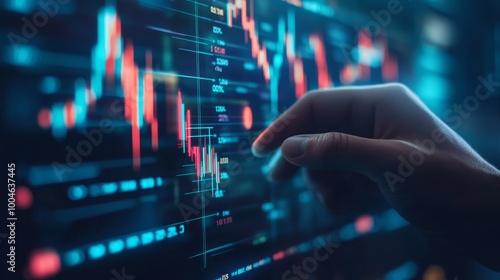 A hand interacting with a digital financial chart displaying market trends.