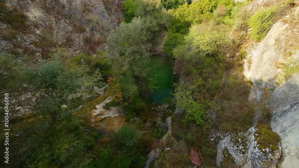 Drone view at Hotnishki Waterfall near Veliko Tarnovo during summer with great acqua colors Drone view at Hotnishki Waterfall near Veliko Tarnovo during summer with great acqua colors