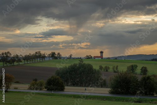 Autumn orange sunset with trees and fields near Roprachtice village in mountains photo