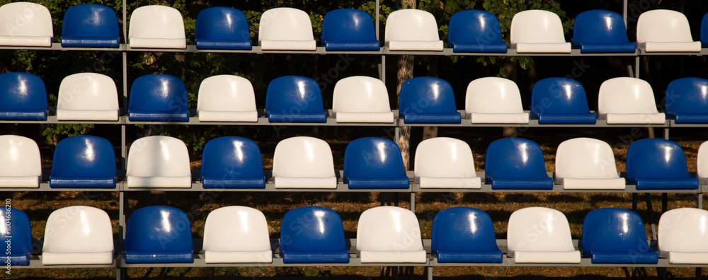 Fototapeta premium Plastic multicolored stadium seats.