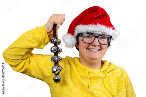 Young woman wearing glasses and festive red Father Christmas Santa hat with white fur edging holding jingle bells photo