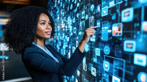 A professional woman engages with a vibrant digital interface, selecting icons and navigating through various multimedia options in a contemporary office setting