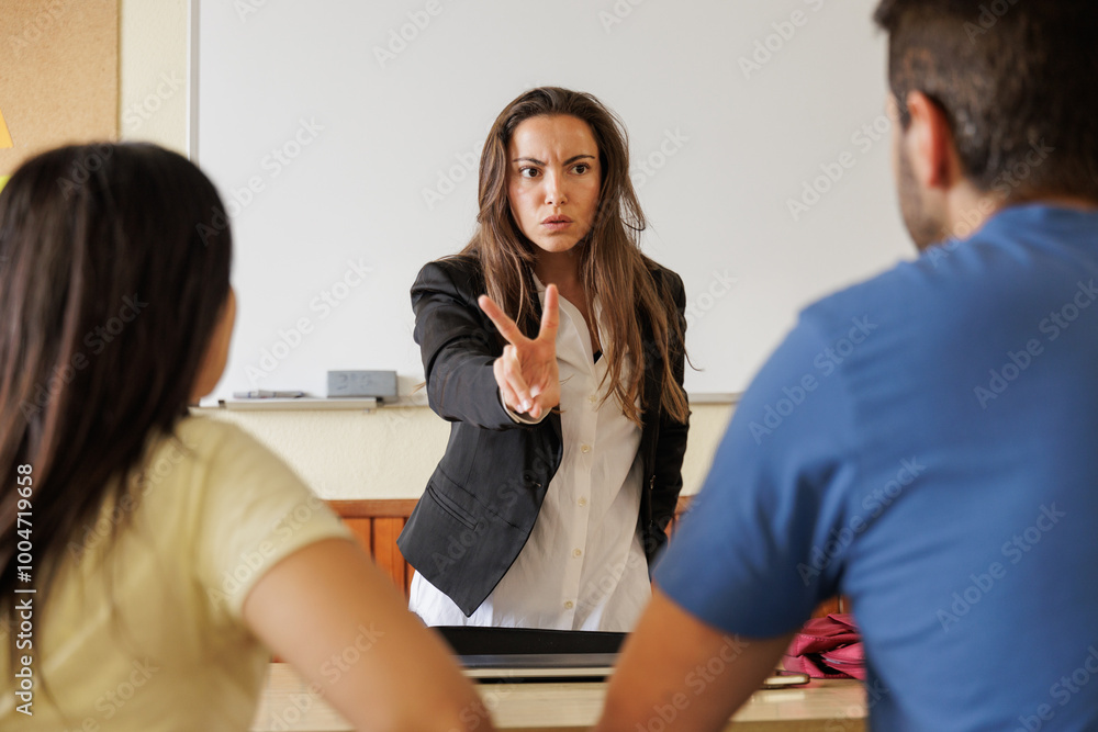 Meeting between teacher and family of a student at school. Parents protest and demand explanations for their son's grades. They are very angry. Meeting between teacher and family of a student at school. Parents protest and demand explanations for their son's grades. They are very angry.