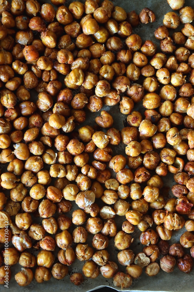 Sheet pan with homemade roasted chickpeas. Top view. Sheet pan with homemade roasted chickpeas. Top view.