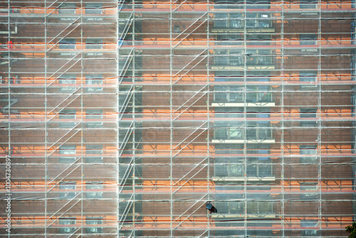 Scaffold sheeting net wrapped apartments building during insulation in england uk photo